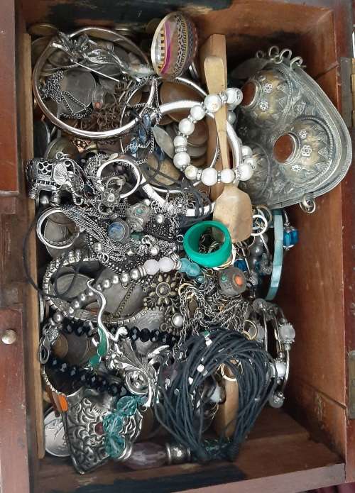 Wooden box with secret compartment filled with a mix or internation coins and costume jewellery